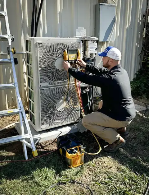 A tech from Cornerstone Air runs a diagnosis on a customer's mini split system.